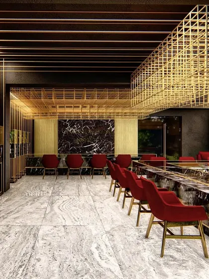 Another perspective of the Lucknow showroom, where vertical brass rods and dark marble displays create a rhythmic, gallery-like setting for the jewellery pieces.