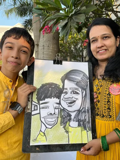 A mother and son duo with their fun caricature. It's a great activity for families attending a wedding.