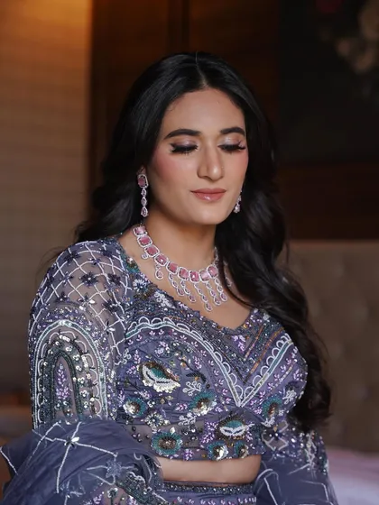 Another beautiful portrait showing the soft waves in her hair and the flawless finish of her makeup.