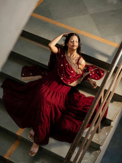 Another high-angle shot that captures a moment of serene contemplation. The light from above beautifully illuminates her.