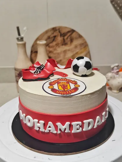 For the ultimate football fan, I created this Manchester United themed cake. It features an edible team logo, a hand-sculpted fondant scarf, and even tiny football boots. It’s the perfect way to celebrate a birthday with team spirit.