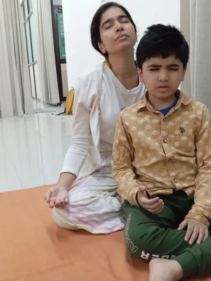A mother and son meditating side by side. This space is for families, for individuals, for anyone with a longing to connect.