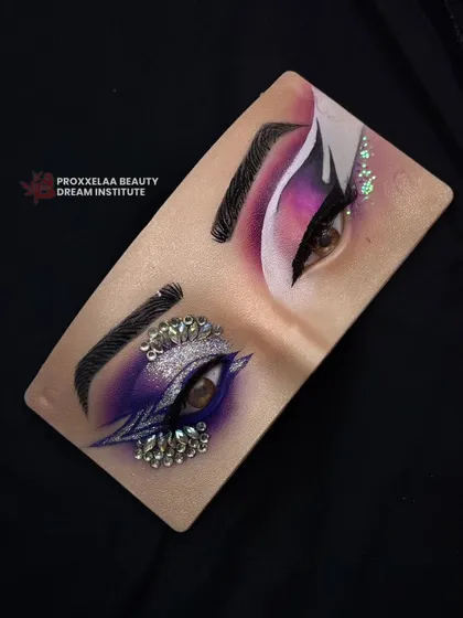 Eyes are the window to the soul. This advanced eye board practice combines a purple smokey eye with intricate rhinestone placement for a dazzling effect.