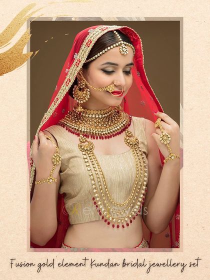 This fusion gold Kundan bridal set is designed for a complete and stunning look. It comes with a matched short necklace, a long rani haar, earrings, matha patti, hand ornaments, and a nath for your big day.