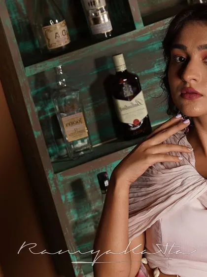 A moody, artistic shot highlighting the draped chiffon off-shoulder top. This ensemble is designed for the fashion-forward woman.