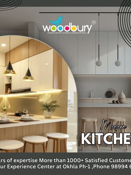 This design concept combines white cabinets with wood accents and a breakfast bar. The pendant lights add a stylish, decorative element to the space.