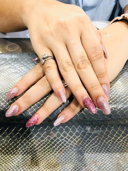 Another angle of the pink glitter ombre, showing the blend of different glitter sizes.