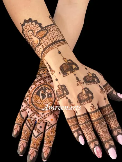 A beautiful design for the back of the hands, featuring swans, elephants, and delicate hanging motifs.