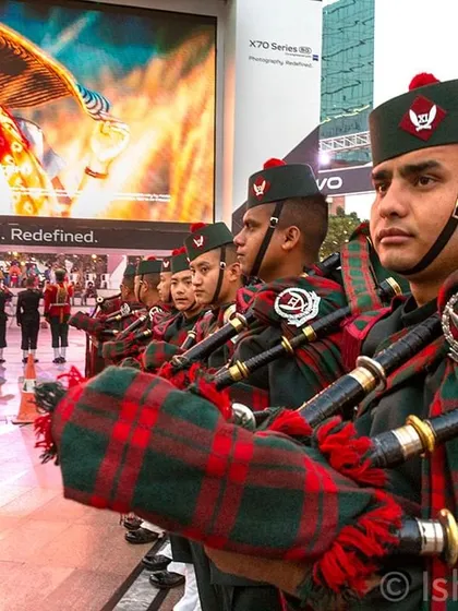 A close-up of an Indian Army bagpiper, focusing on the details of the uniform and the performer's concentration amidst the larger 'Vijay Parv' event. Even in a crowd, I find the individual stories that make an event memorable.