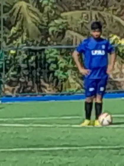 A player preparing to take a set-piece during a tournament match. These are the moments where focus and technique matter most.