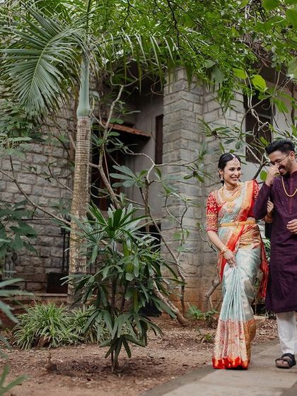A couple walks through the lush garden pathways, a perfect example of the many scenic spots for a romantic stroll and photoshoot.