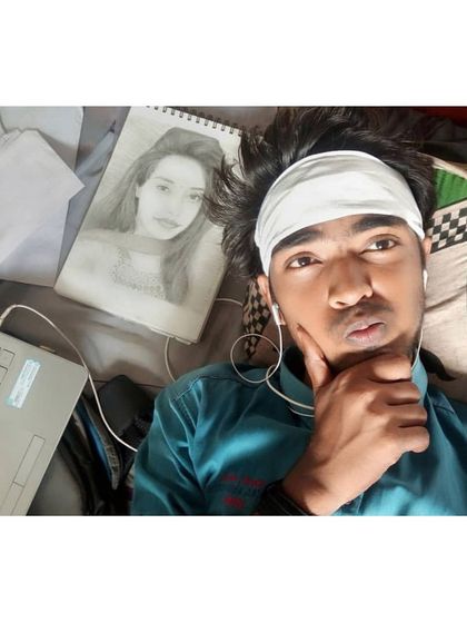 A photo from my early days, thinking about what to draw next. The passion was always there, even when the skills were still developing.