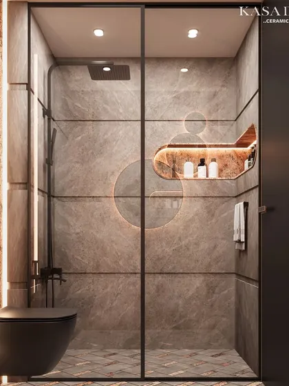 A look inside the shower of our Red Ruptura stone project. The design continues seamlessly, with custom-cut stone panels and integrated, backlit shelving that combines functionality with high-end aesthetics.