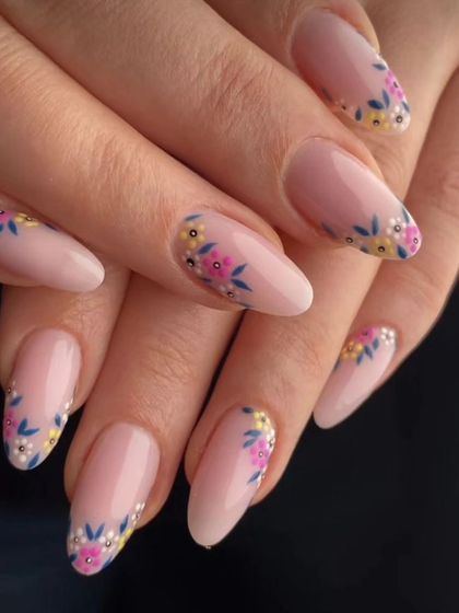 A very delicate and pretty design featuring hand-painted tiny floral bouquets on a sheer pink base. Perfect for a spring or summer look.
