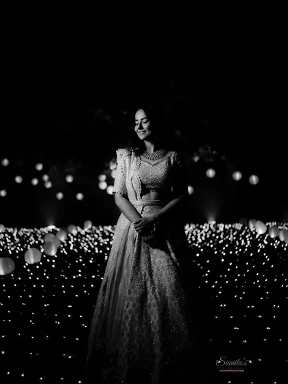 A bride surrounded by a field of lights. This stunning black and white portrait is both magical and modern, creating a truly unforgettable image.