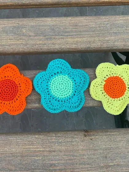 A set of three vibrant flower coasters, perfect for adding a pop of color to your table. I can make these in any color palette to match your home decor.