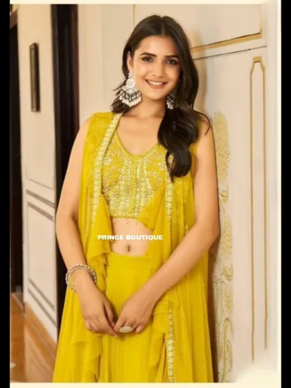 A close-up portrait in the yellow Indowestern outfit, highlighting the beautiful statement earrings and the detailed blouse.