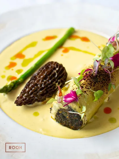 The finished Palak Mushroom Cannelloni, served with a prized Gucchi (morel mushroom) and a fresh asparagus spear. It’s an earthy, comforting, and elegant vegetarian main course.