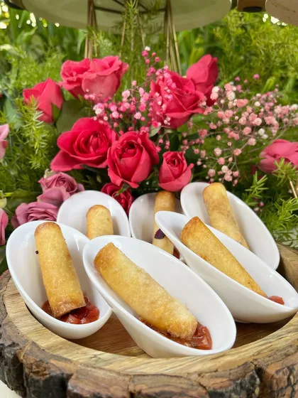 Crispy Corn Cream Phyllo Rolls, served with a dipping sauce, are a perfect poolside snack.