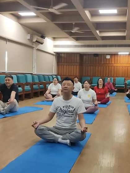 Students in our Noida center practicing Sukhasana (Easy Pose) and preparing for pranayama. The focus is on creating a stable and comfortable foundation for breathwork.