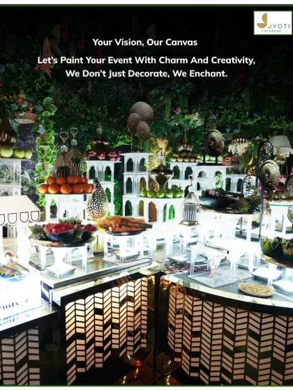 An artistic fruit and dessert station designed with mirrored surfaces and geometric patterns. The multi-level display adds depth and makes the colourful spread even more enticing.
