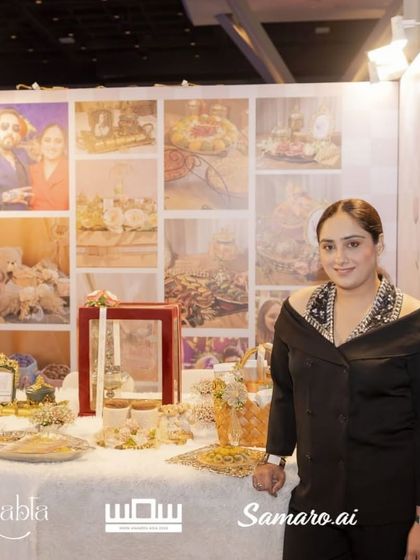 Posing in front of my stall's photo wall, which features pictures of my favourite hamper creations.
