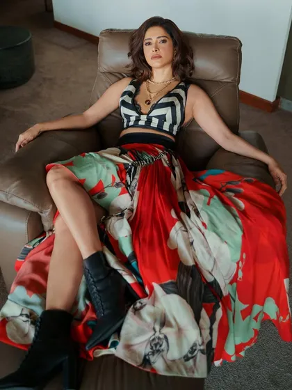 Ready for a pool party! I styled Nushrratt Bharuccha in this edgy look, pairing a bold floral skirt with a striped crop top and combat boots for a fun, high-fashion contrast.