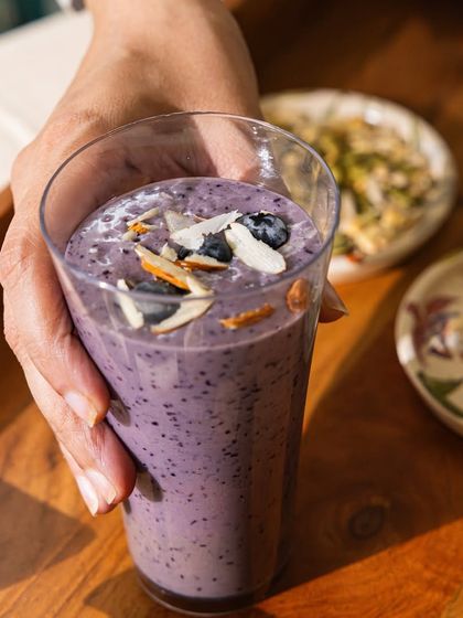 Another shot of our vibrant and delicious berry smoothie, perfect for a hot day or as a post-workout refreshment. It's pure, natural goodness in a glass.