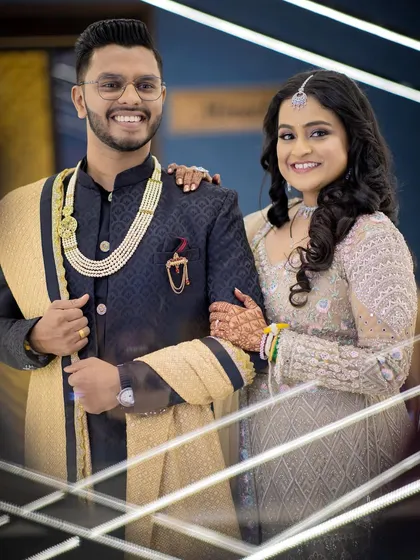 A sharp and stylish portrait of Aditya and Samruddhi. The modern, geometric background adds a unique and contemporary feel to their engagement photo.