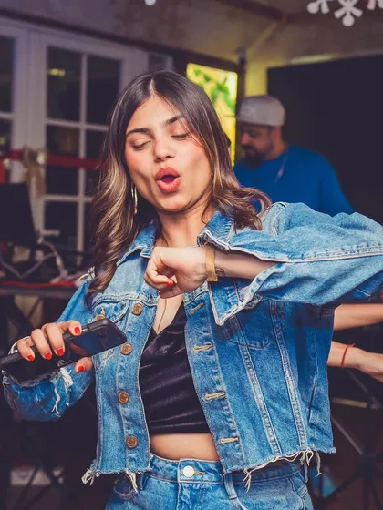 A guest in a denim jacket dancing to the beats. The style at Monkey Bar is always cool and casual.