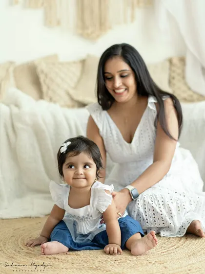 A mother and daughter sharing a quiet moment on the floor of our boho studio.