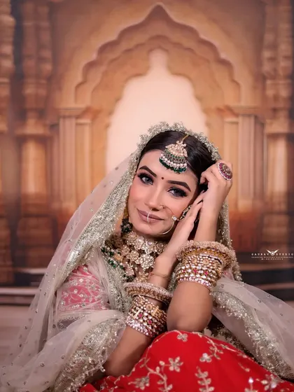 A relaxed, seated portrait of the bride, exuding grace and elegance.