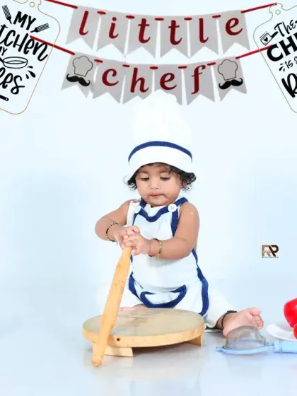 The little chef gets to work, using a rolling pin in this fun and interactive kitchen setup. These sessions are designed to capture your child's playful imagination.