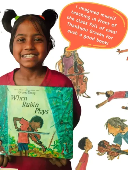 After reading "When Rubin Plays," a young girl proudly holds the book and a drawing of her dream. The activity inspired children to draw themselves doing what they love, surrounded by a supportive audience of "Bookwallah's Fireflies."