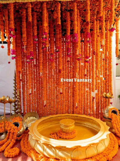 A Haldi ceremony is all about vibrant traditions. I created this immersive experience with a dense canopy of fresh marigolds and a magnificent brass urli for the sacred turmeric bath, filling the space with color and auspicious energy.