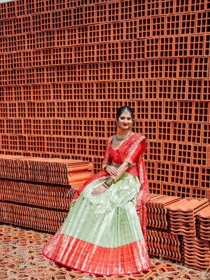 My beautiful client Chethana looks stunning in this custom Kanchi Pattu tissue lehenga. The sea-green and red combination is a classic, and I designed it as a Langa Voni for a traditional yet fresh look for her special day.