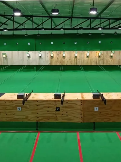 A wide view of our professional, multi-lane 10-meter shooting range. This air-conditioned facility is equipped with electronic targets to simulate real competition environments.