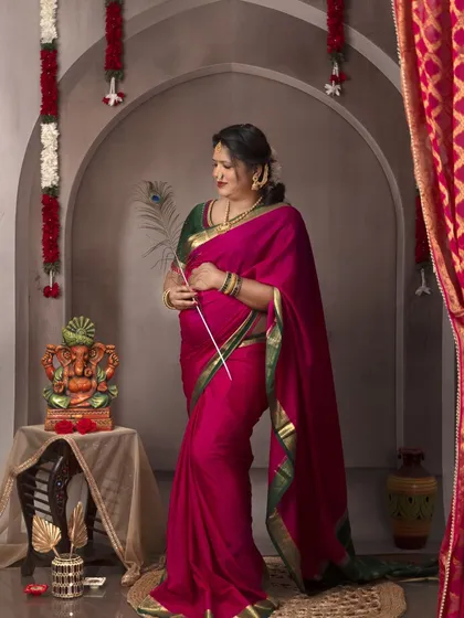A graceful pose with a peacock feather, a symbol of beauty and divinity in Indian culture. This adds a unique and artistic touch.