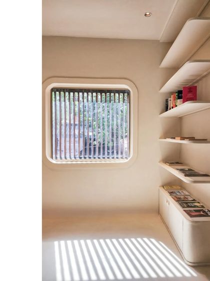 In this media office in Santacruz, Mumbai, a simple moment where design and daylight meet turns the floor into a canvas. The shadow play from the window louvers adds a dynamic, ever-changing pattern to the minimalist, Wabi-sabi inspired interior.