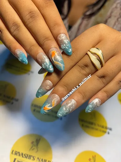 Imagine creating a miniature aquarium on a set of nails. This design uses a beautiful blue ombre, hand-painted koi fish, and realistic 3D water bubbles. It’s a great example of the creative and technical skills you'll develop in my courses.