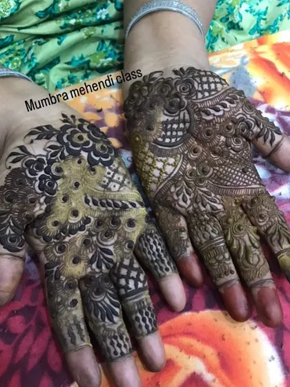A great example of two different styles on each hand, one with more checks and fills, the other with bolder floral work.