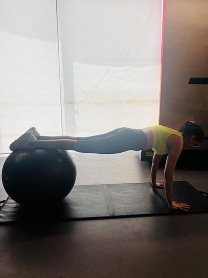 A plank on a stability ball is an advanced variation that intensely fires up the core. The unstable surface forces your deep abdominal and back muscles to work harder to maintain a straight line from head to heels.