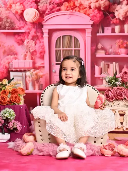 A dreamy pink blossom theme for a little fairy. This elaborate setup is filled with shades of pink for a magical, floral photoshoot.