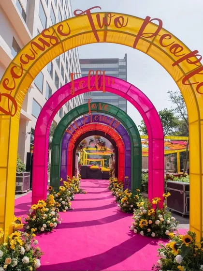 To make a fun and unforgettable first impression, we designed this vibrant rainbow archway for a Mehandi entrance. The bright pink carpet and sunflower accents guide guests into a celebration filled with color and energy.