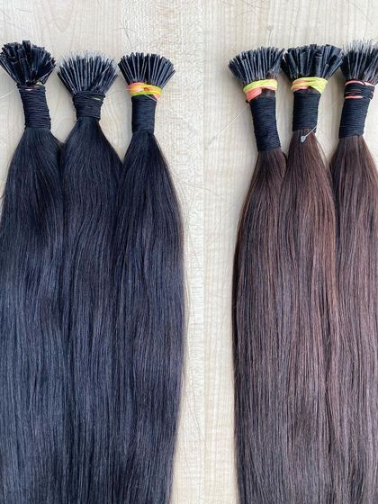 A comparison of our black and brown I-Tip extensions, both made from 100% remy human hair.