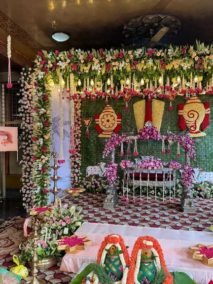 A wide shot of the entire naming ceremony hall, showing the scale of the traditional decor.