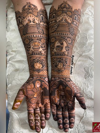 A full bridal mehendi for a traditional wedding, featuring bride and groom figures, peacocks, swans, and auspicious kalash motifs.