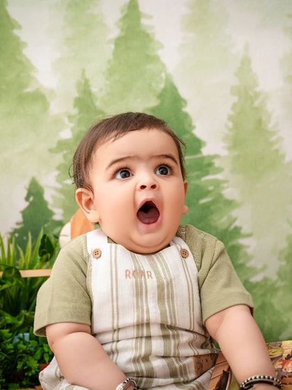 A perfect "surprised" face from this little one, making for a funny and memorable shot during his jungle adventure.