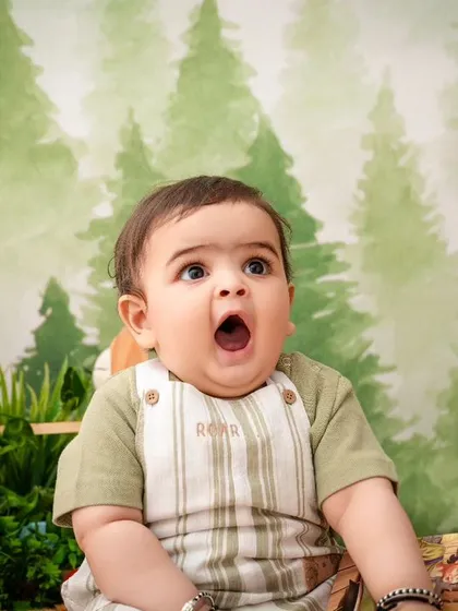 A perfect "surprised" face from this little one, making for a funny and memorable shot during his jungle adventure.