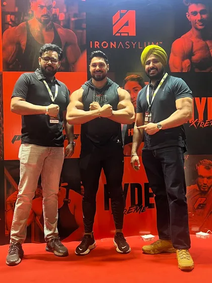 At an expo with fellow fitness enthusiasts. These events are the best place to meet, learn, and grow together as a community.